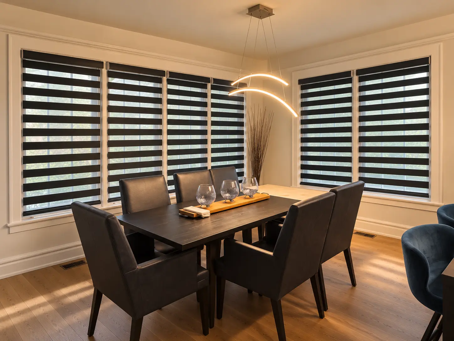 Black zebra shades on a run of dining-room windows
