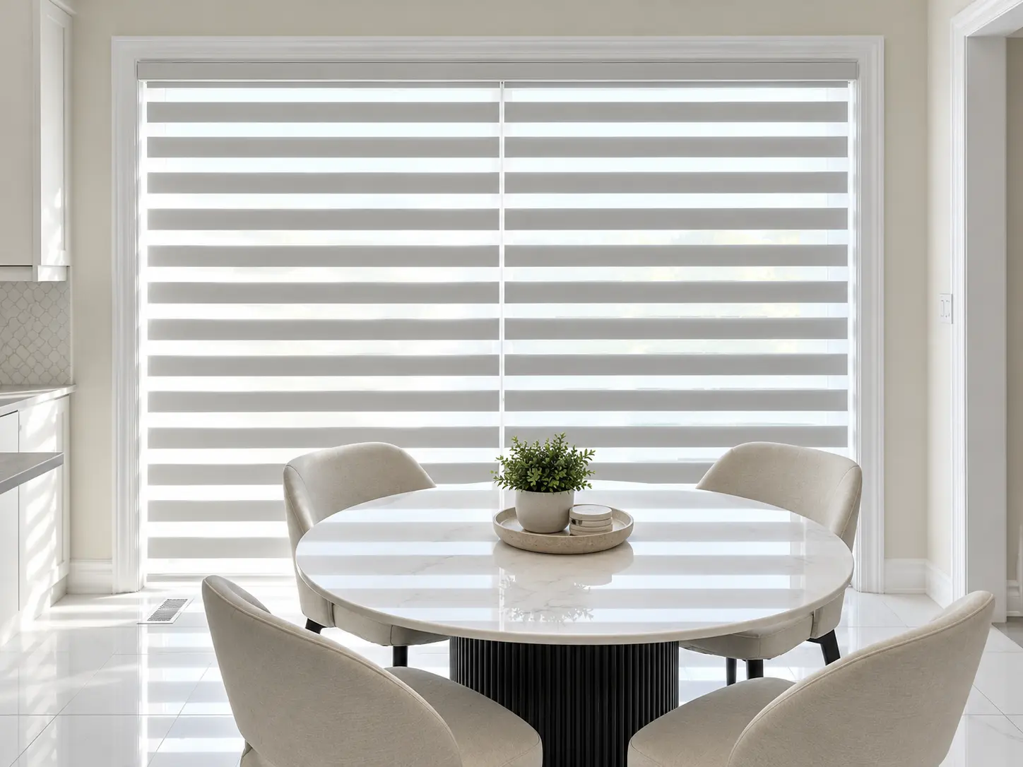 Light grey zebra shades on a kitchen dining-area patio door